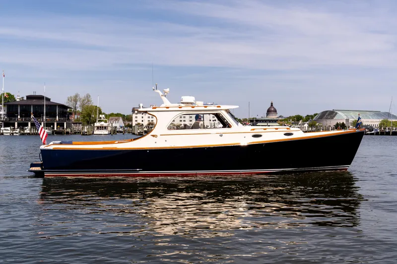 Old Fashioned Yacht Photos Pics 2002 Hinckley Picnic Boat EP on calm water, showcasing elegant design and classic style.