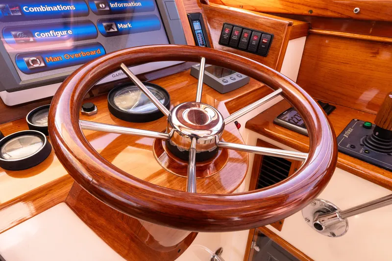 Old Fashioned Yacht Photos Pics Steering wheel of a 2002 Hinckley Picnic Boat EP with navigation instruments.