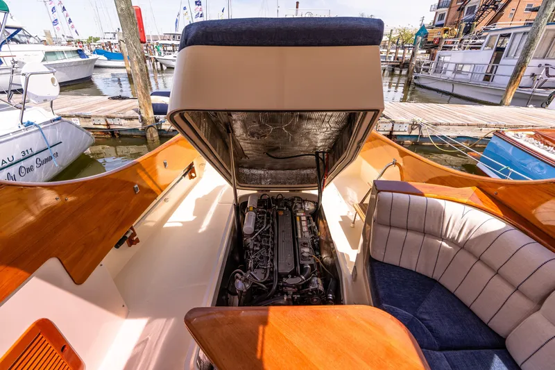 Old Fashioned Yacht Photos Pics 2002 Hinckley Picnic Boat EP engine compartment with open hatch, docked at marina.