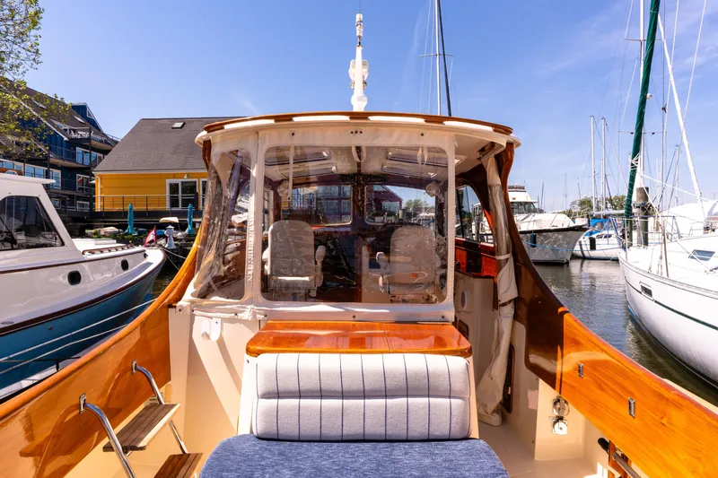 Old Fashioned Yacht Photos Pics 2002 Hinckley Picnic Boat EP docked at a marina, showcasing elegant wooden interior.