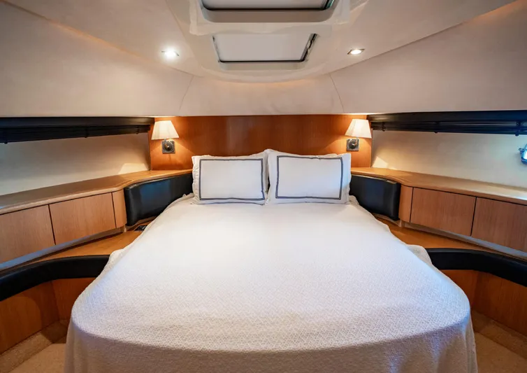  Yacht Photos Pics Luxurious bedroom interior of 2010 Fairline Squadron 78 yacht with elegant lighting and cozy bedding.