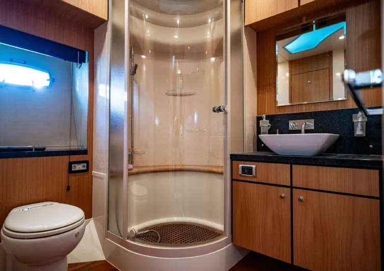  Yacht Photos Pics Luxurious bathroom in 2010 Fairline Squadron 78 yacht with modern shower and vanity.
