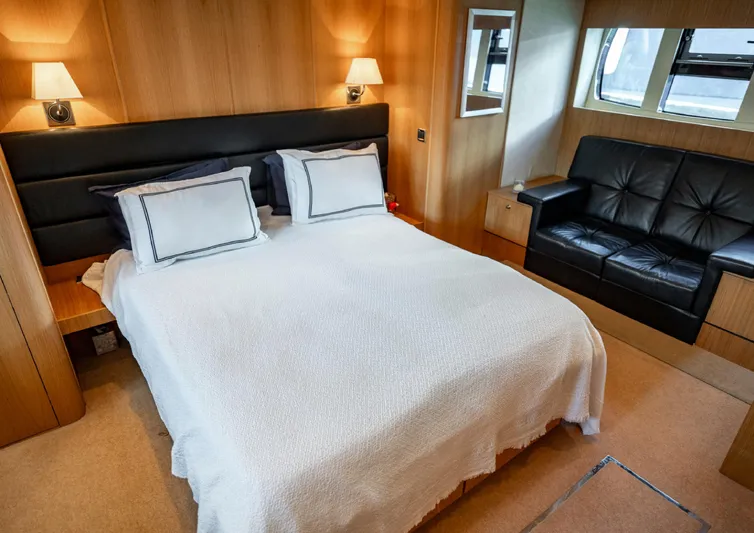  Yacht Photos Pics Luxurious bedroom in 2010 Fairline Squadron 78 yacht with elegant decor and comfortable furnishings.