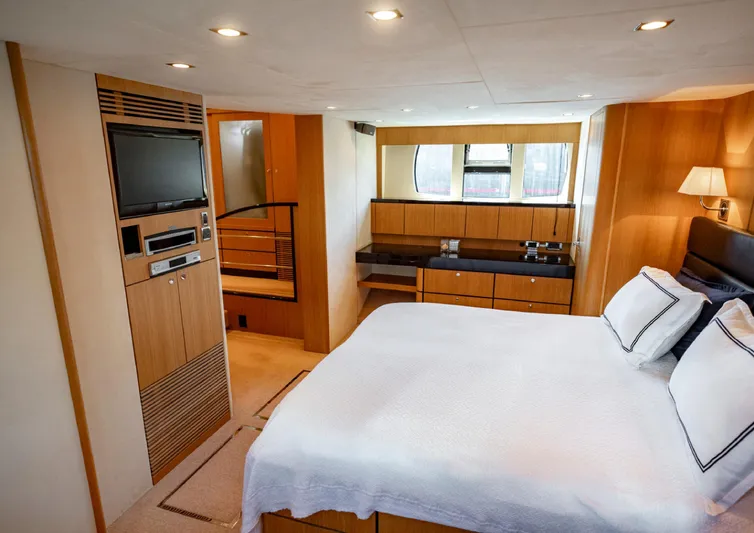  Yacht Photos Pics Luxurious bedroom interior of 2010 Fairline Squadron 78 yacht, featuring modern amenities and elegant design.