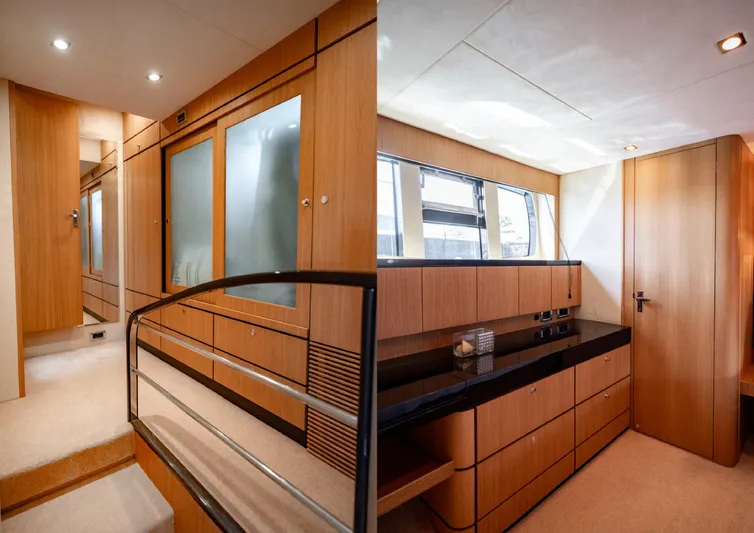  Yacht Photos Pics Luxurious interior of 2010 Fairline Squadron 78 yacht, featuring elegant wood paneling and modern design.