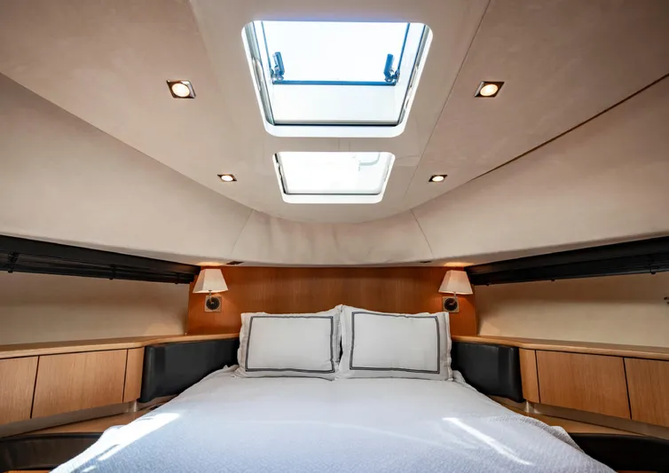  Yacht Photos Pics Luxurious cabin interior of 2010 Fairline Squadron 78 yacht with skylight and elegant bedding.