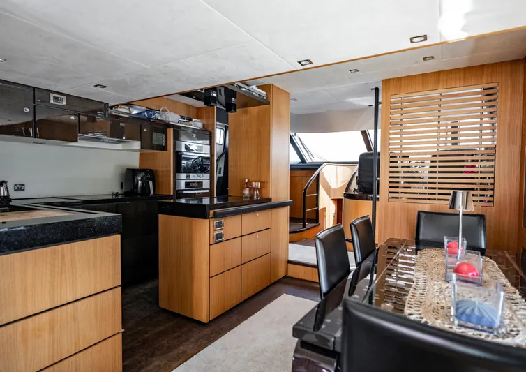  Yacht Photos Pics Luxurious interior of 2010 Fairline Squadron 78 yacht with modern kitchen and dining area.