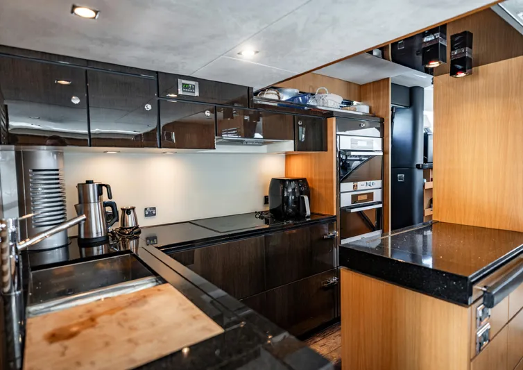  Yacht Photos Pics Luxurious kitchen interior of 2010 Fairline Squadron 78 yacht with modern appliances.