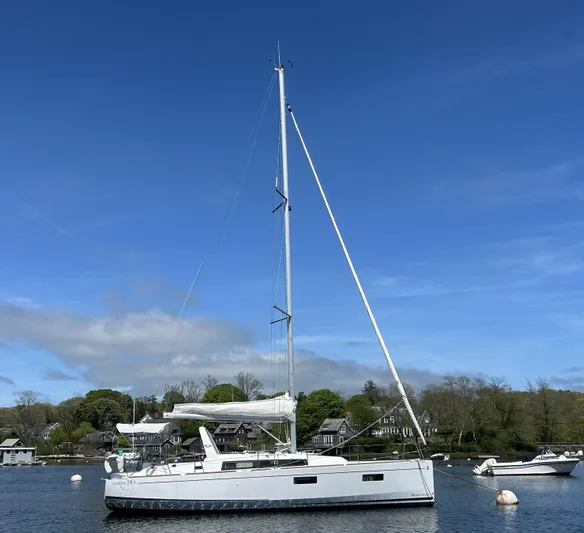Ariel Yacht Photos Pics 2019 Beneteau 38.1 sailboat anchored in a scenic harbor.