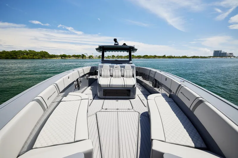  Yacht Photos Pics 2025 Midnight Express 43' Open boat on calm water, featuring spacious seating and sleek design.