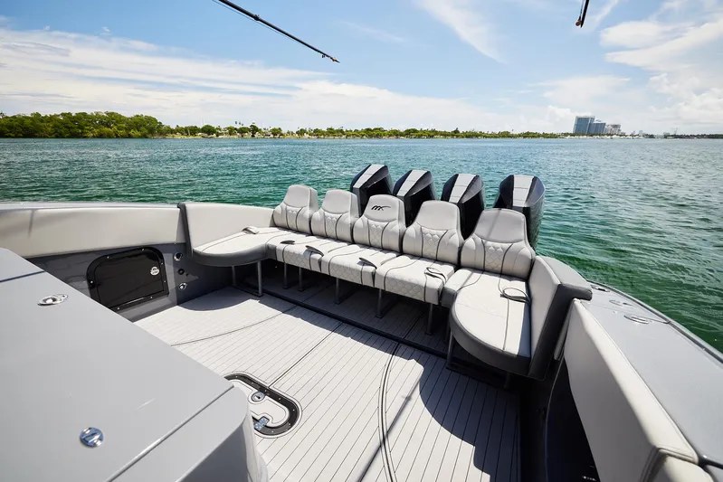  Yacht Photos Pics 2025 Midnight Express 43' Open boat with spacious seating on calm waters.