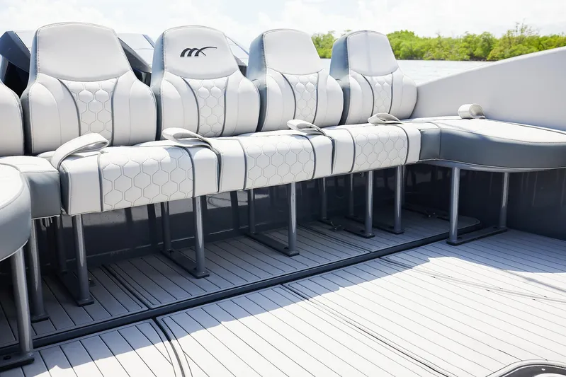  Yacht Photos Pics Luxury seating on 2025 Midnight Express 43' Open boat, featuring sleek design and comfort.