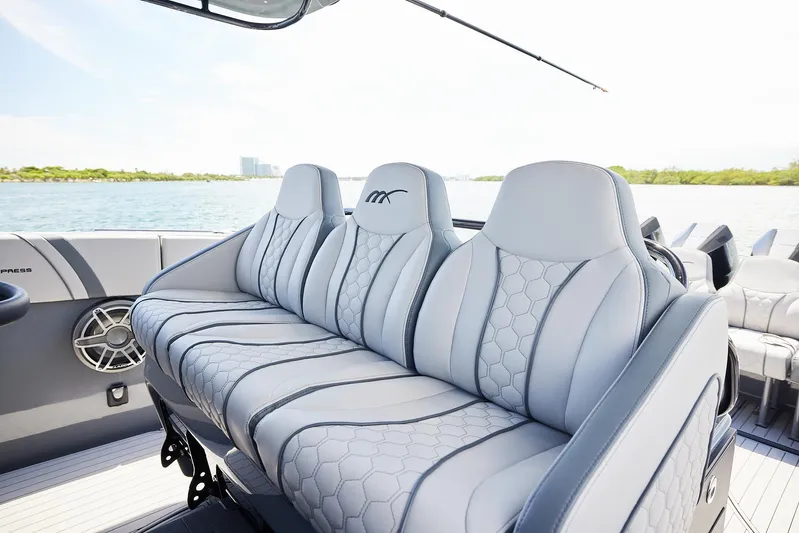  Yacht Photos Pics Luxurious seating on 2025 Midnight Express 43' Open boat, featuring sleek design and waterfront view.