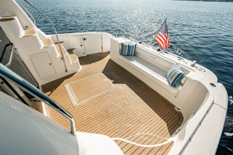 Love & Luck II Yacht Photos Pics 2007 Sea Ray 580 Sedan Bridge yacht deck with seating, American flag, and ocean view.