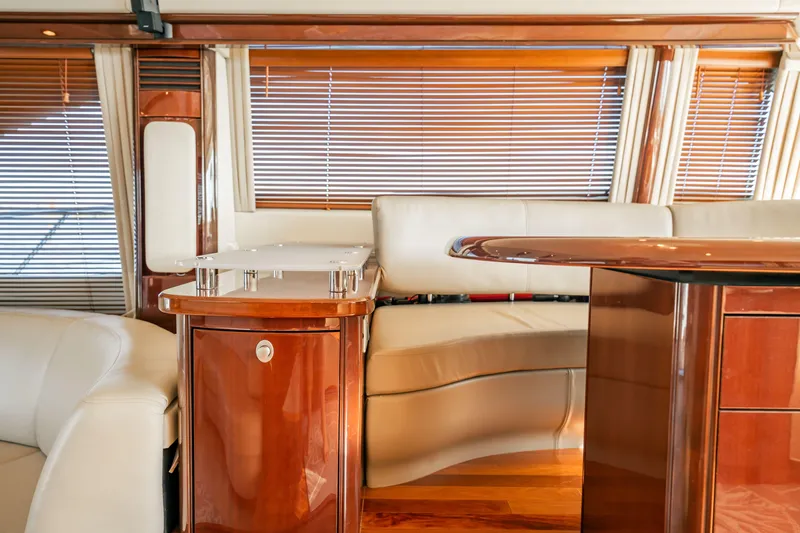Love & Luck II Yacht Photos Pics Luxurious interior of 2007 Sea Ray 580 Sedan Bridge yacht with elegant wood finishes.