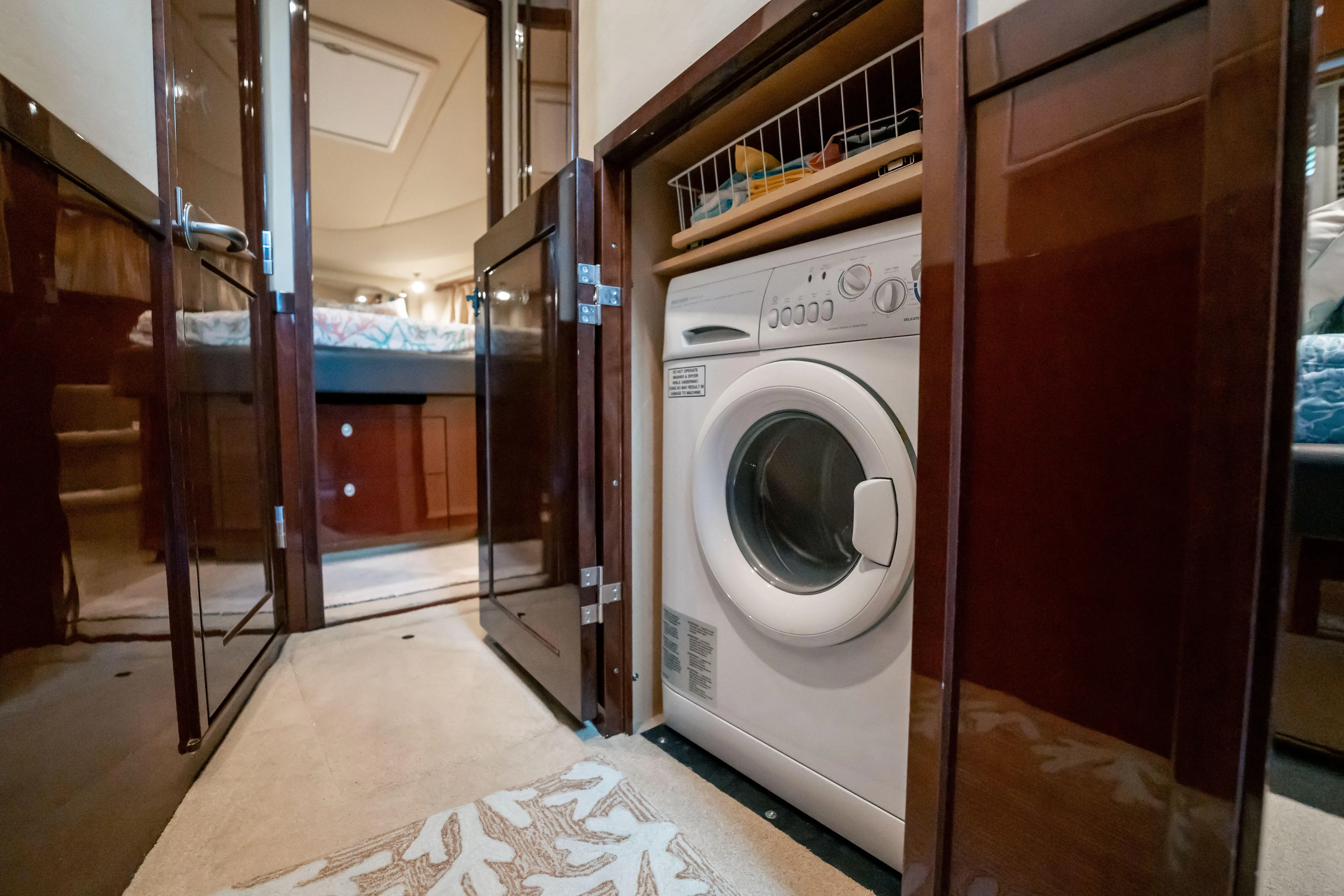 Love & Luck II Yacht Photos Pics 2007 Sea Ray 580 Sedan Bridge interior with built-in washing machine.