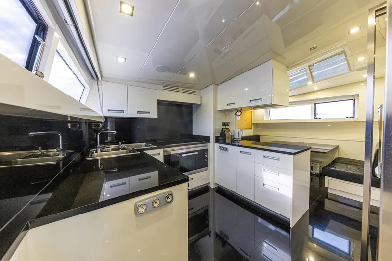  Yacht Photos Pics Luxurious kitchen interior of 2008 Sanlorenzo SL88 yacht with modern appliances and sleek design.