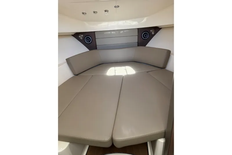  Yacht Photos Pics 2019 Boston Whaler 315 Conquest cabin interior with beige seating and modern design.