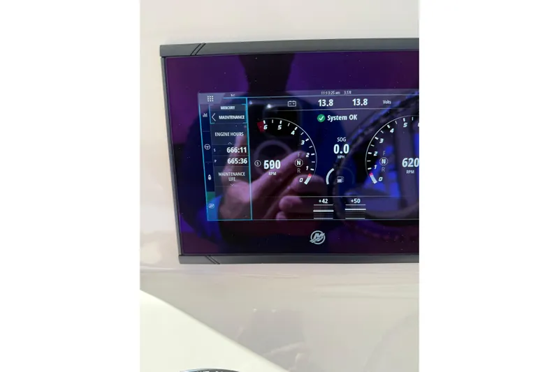  Yacht Photos Pics Dashboard display of a 2019 Boston Whaler 315 Conquest boat showing engine metrics.