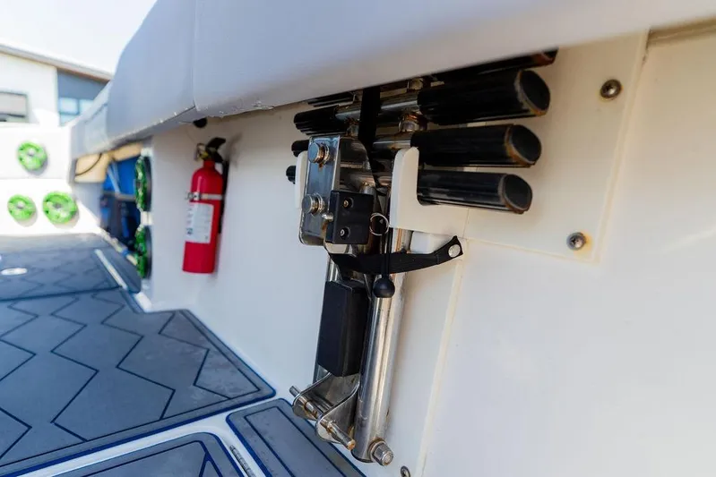  Yacht Photos Pics 2022 Fountain 34 SC boat interior with fire extinguisher and rod holders.