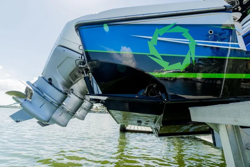  Yacht Photos Pics 2022 Fountain 34 SC boat with dual outboard motors on water.