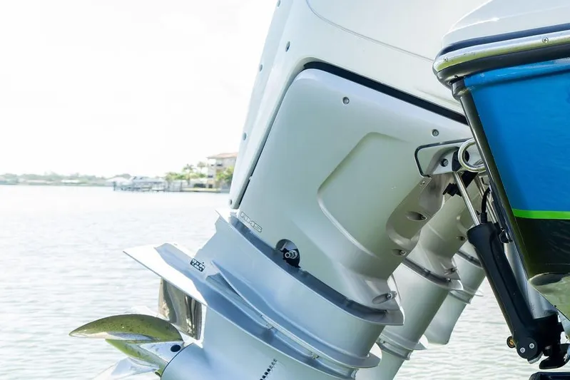  Yacht Photos Pics 2022 Fountain 34 SC boat engine close-up on water.