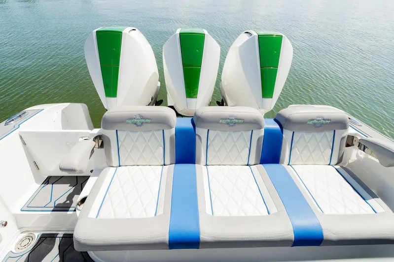  Yacht Photos Pics 2022 Fountain 34 SC boat with stylish seating and triple outboard engines.