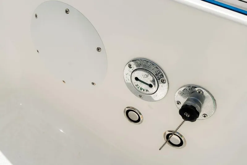  Yacht Photos Pics Close-up of 2022 Fountain 34 SC boat waste and water connections.