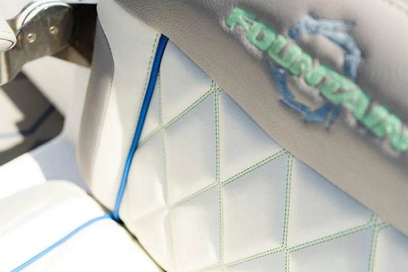  Yacht Photos Pics Close-up of 2022 Fountain 34 SC boat seat with logo and stitching detail.