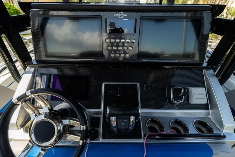  Yacht Photos Pics 2022 Fountain 34 SC boat dashboard with advanced navigation and control systems.