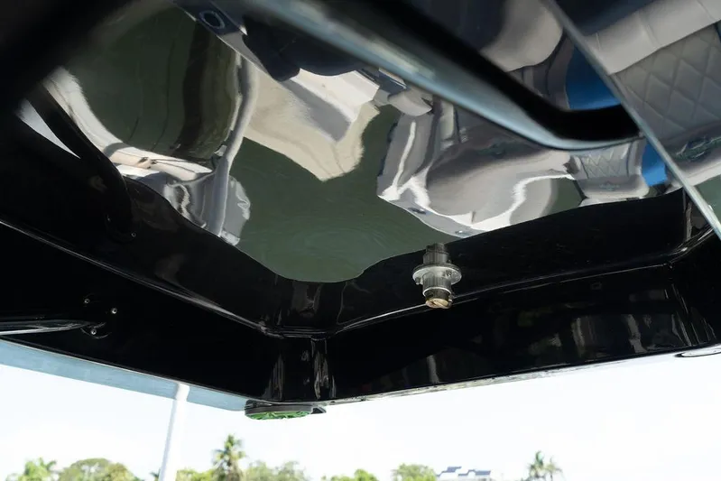  Yacht Photos Pics Close-up of 2022 Fountain 34 SC boat's glossy black surface and hardware detail.