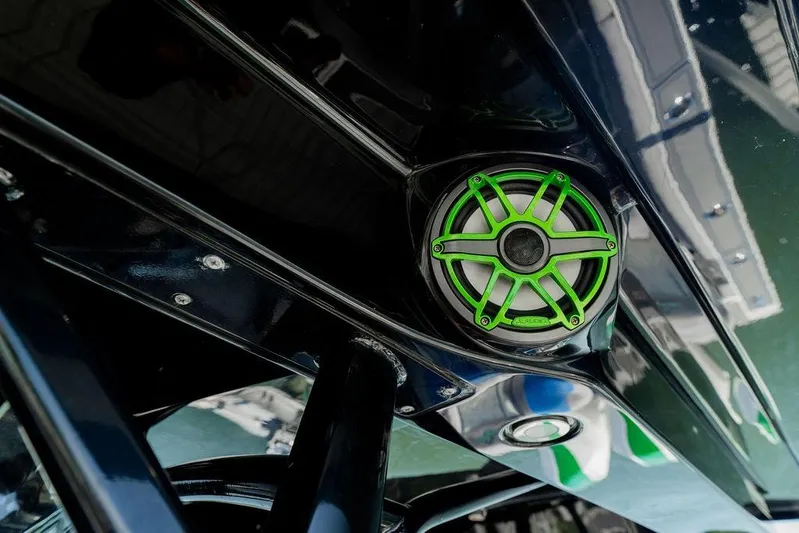  Yacht Photos Pics 2022 Fountain 34 SC boat with green-accented speaker detail.