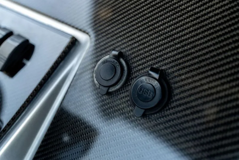  Yacht Photos Pics Carbon fiber dashboard with USB ports on 2022 Fountain 34 SC boat.