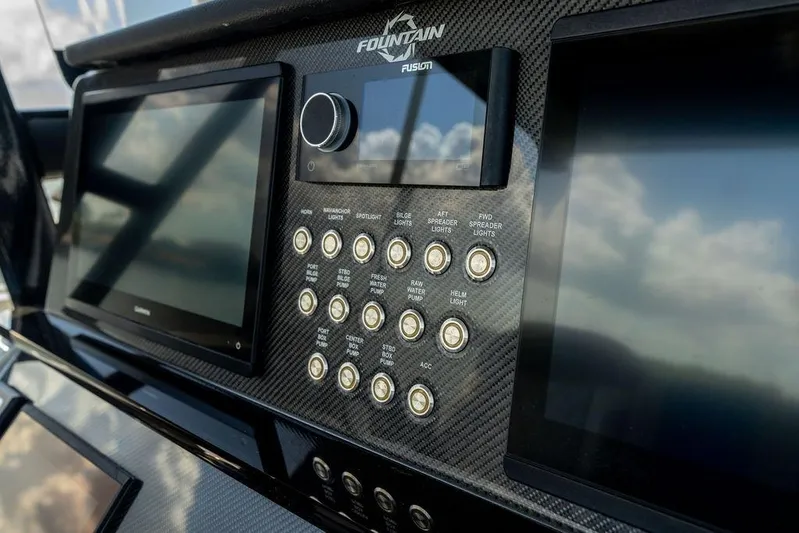  Yacht Photos Pics Control panel of 2022 Fountain 34 SC boat with digital displays and buttons.