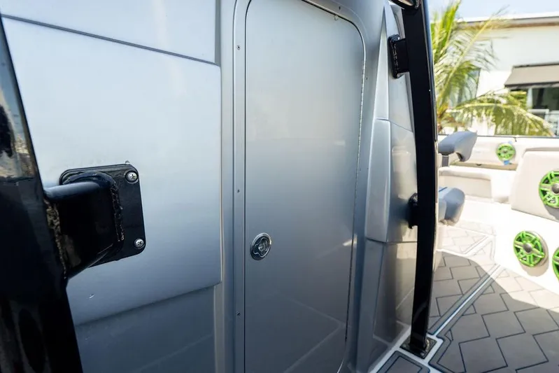  Yacht Photos Pics 2022 Fountain 34 SC boat cabin door with sleek design and modern features.