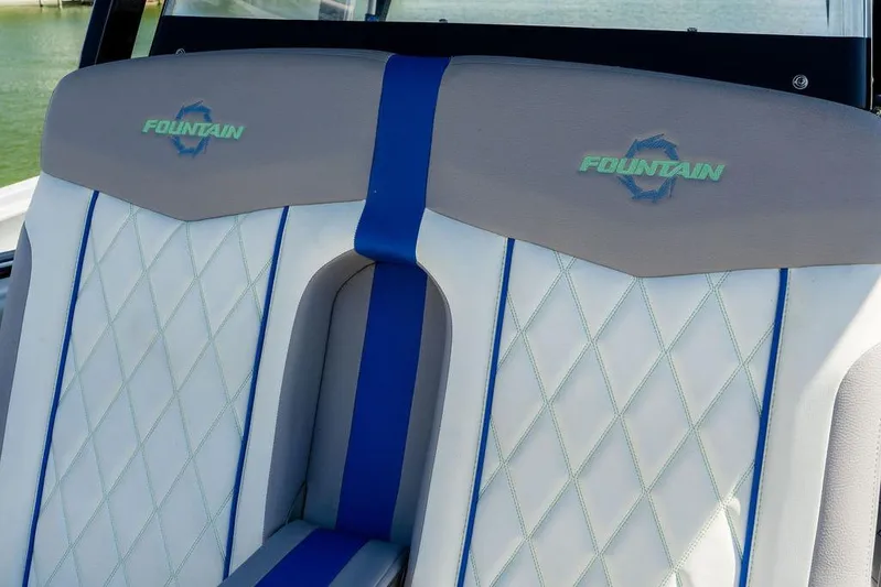  Yacht Photos Pics 2022 Fountain 34 SC boat seats with blue accents and diamond stitching.