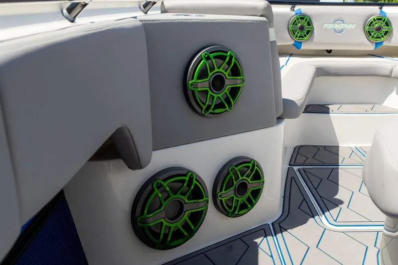  Yacht Photos Pics 2022 Fountain 34 SC boat interior with green speakers and gray seating.