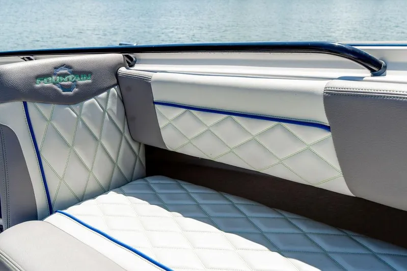  Yacht Photos Pics 2022 Fountain 34 SC boat interior with elegant diamond-stitched upholstery.