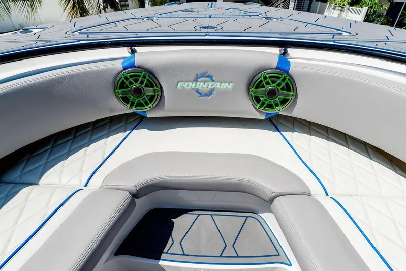  Yacht Photos Pics 2022 Fountain 34 SC boat interior with stylish seating and green speakers.