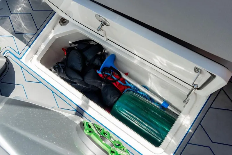  Yacht Photos Pics Storage compartment of 2022 Fountain 34 SC boat with equipment and accessories.