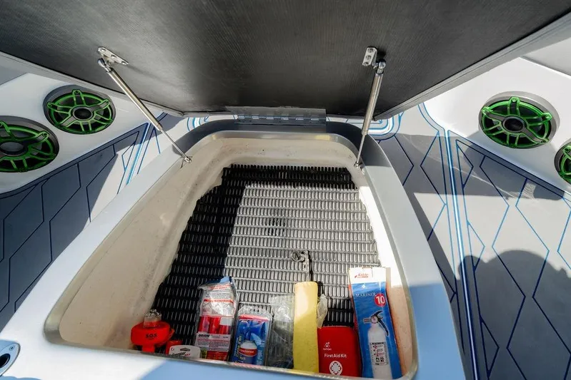  Yacht Photos Pics Storage compartment of 2022 Fountain 34 SC boat with safety equipment and supplies.