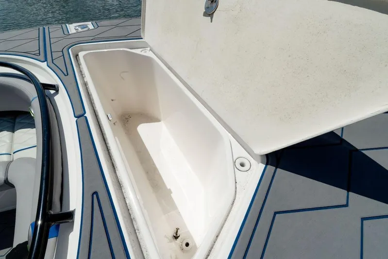  Yacht Photos Pics Open storage compartment on 2022 Fountain 34 SC boat, featuring sleek interior design.