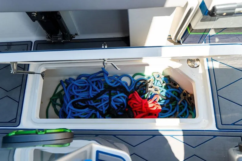  Yacht Photos Pics Storage compartment with colorful ropes on a 2022 Fountain 34 SC boat.