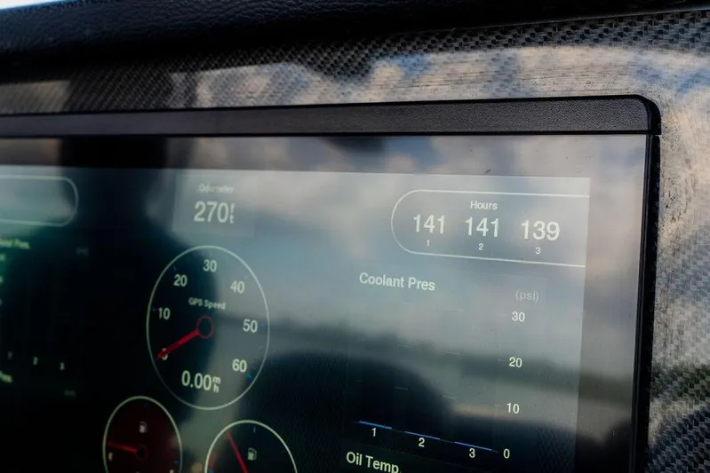  Yacht Photos Pics Dashboard display of a 2022 Fountain 34 SC boat showing speed and engine hours.