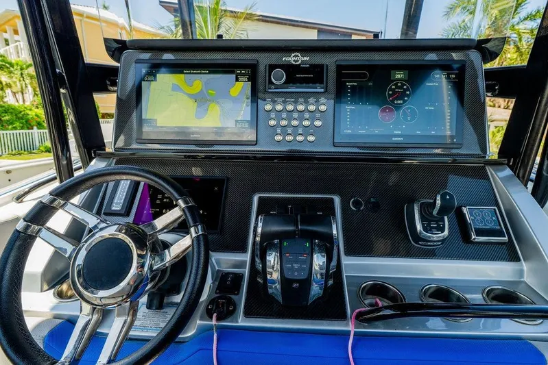  Yacht Photos Pics 2022 Fountain 34 SC boat dashboard with advanced navigation and control systems.
