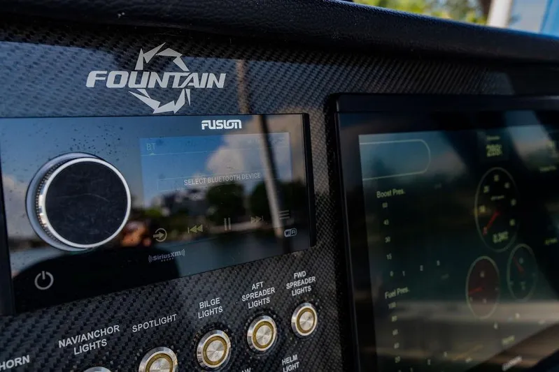  Yacht Photos Pics Dashboard of 2022 Fountain 34 SC boat with Fusion audio system and digital display.