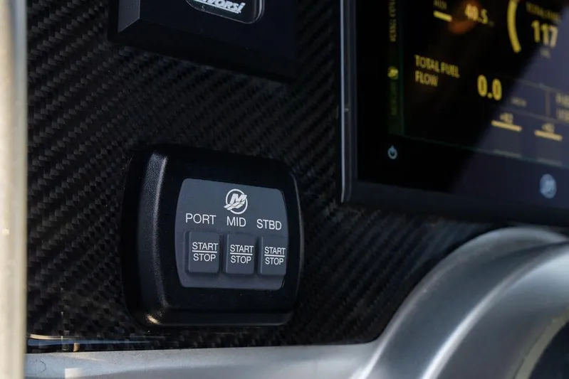  Yacht Photos Pics Control panel of 2022 Fountain 34 SC boat with start/stop buttons.