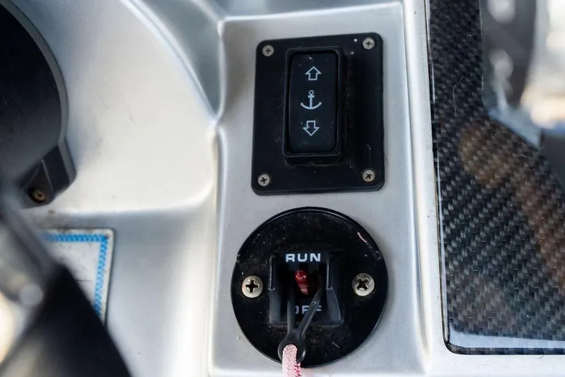  Yacht Photos Pics Control panel of 2022 Fountain 34 SC boat with anchor switch and run/off toggle.