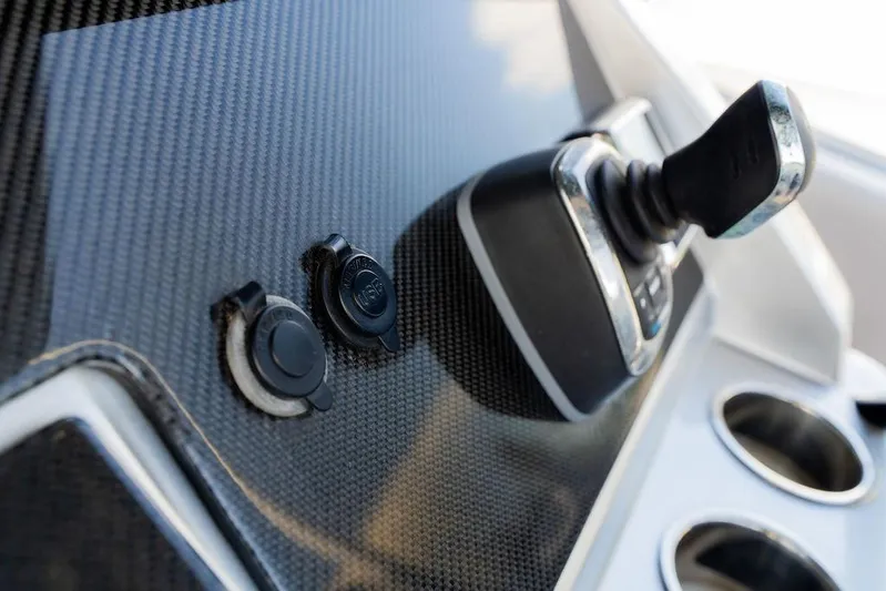  Yacht Photos Pics Control panel of 2022 Fountain 34 SC boat with carbon fiber finish.