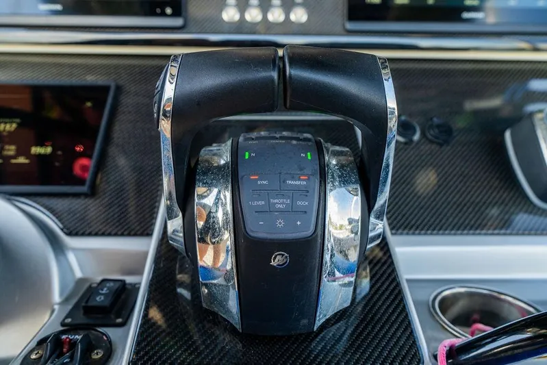  Yacht Photos Pics Close-up of 2022 Fountain 34 SC boat throttle controls on carbon fiber dashboard.
